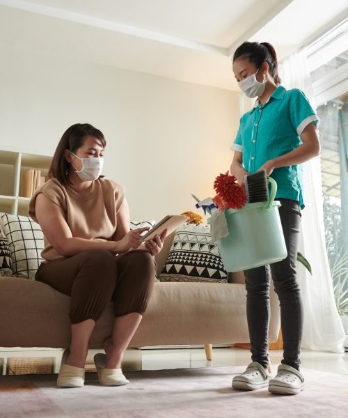 woman-rating-work-of-cleaning-serivce-worker.jpg